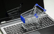 Online Shopping. Shopping cart on a keyboard.
