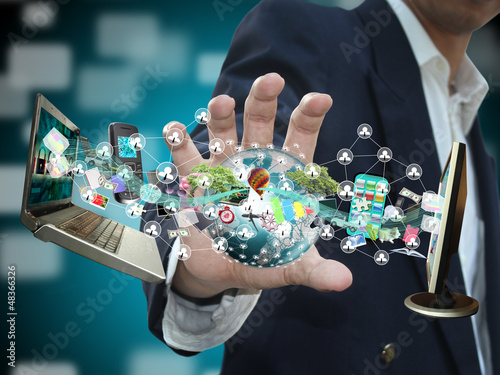Photo: Man holding social object Man holding social object