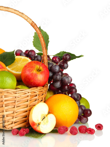 Photo: Assortment of exotic fruits in basket, isolated on white Assortment of exotic fruits in basket, isolated on white