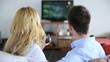 Video: Couple in sofa choosing tv program Couple in sofa choosing tv program