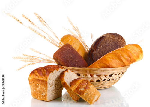 Photo: Fresh bread in basket isolated on white Fresh bread in basket isolated on white