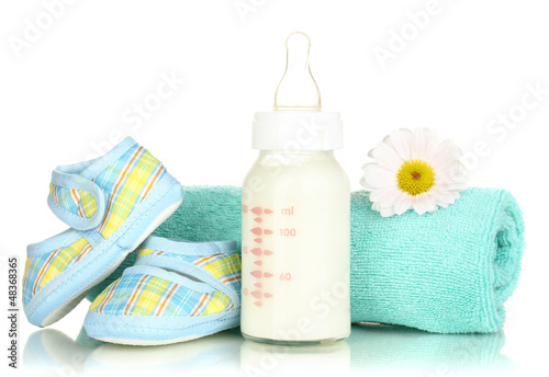 Photo: Baby bottle of milk isolated on white Baby bottle of milk isolated on white