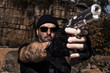 man pointing a gun to the camera