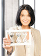 businesswoman holding hourglass