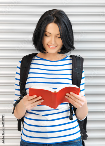 Photo: woman with bag and book woman with bag and book