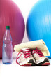Exercise balls with sneakers and a water bottle