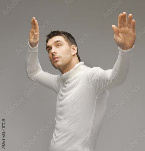 Photo: man working with something imaginary man working with something imaginary