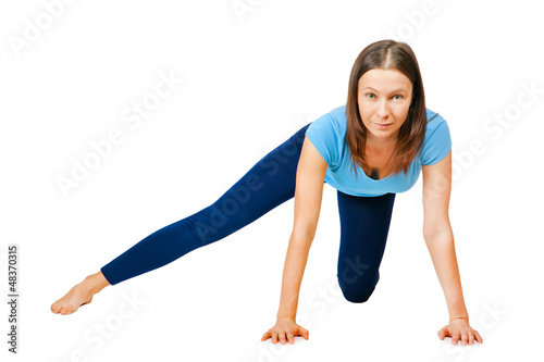 Photo: exercising woman isolated on white exercising woman isolated on white