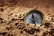 Compass in sand