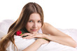 young woman with rose  in a beg
