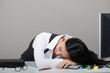 Young woman sleeping on her workplace