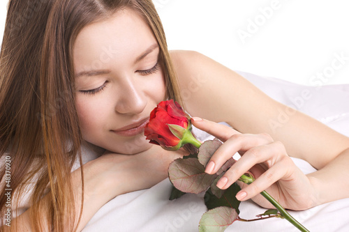 Photo: young woman with rose young woman with rose