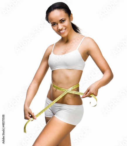 Photo: Woman measuring perfect shape of beautiful waist Woman measuring perfect shape of beautiful waist
