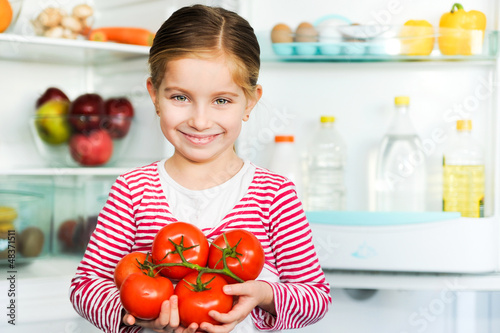 Photo: girl with tomatos girl with tomatos