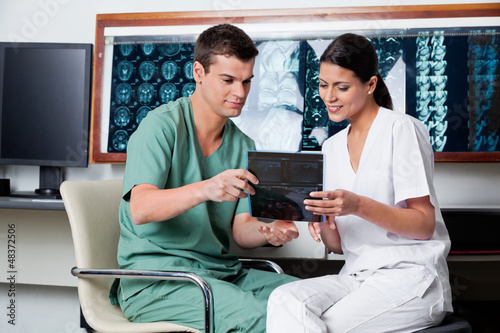 Photo: Medical Technicians Looking At X-ray Medical Technicians Looking At X-ray