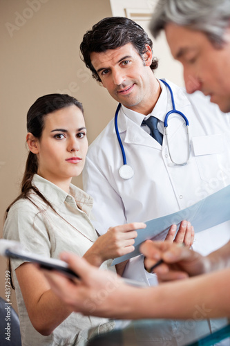 Photo: Medical Coworkers Standing Together Medical Coworkers Standing Together