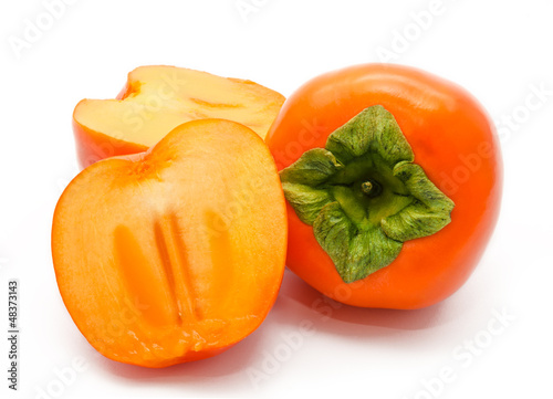 Photo: Orange ripe persimmon isolated on white Orange ripe persimmon isolated on white