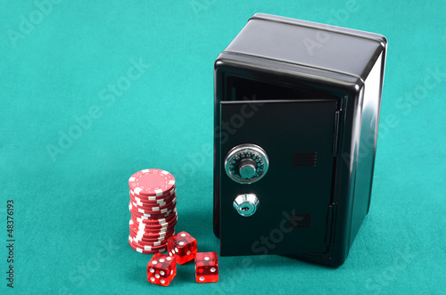 Photo: Poker gambling chips and steel safe Poker gambling chips and steel safe