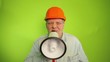 Foreman shouting into a megaphone on a green background