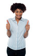 Excited woman gesturing double thumbs up
