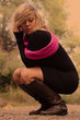 Blond woman posing at the woods