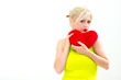 woman holding a red heart