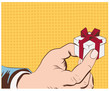 Hand holding beautiful gift box.Vector illustration