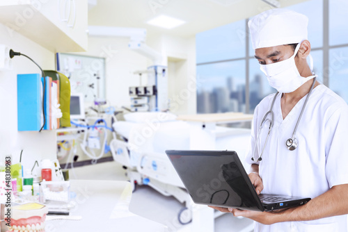 Photo: Doctor working with laptop Doctor working with laptop