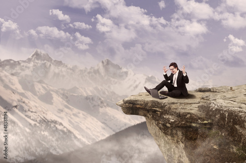 Photo: Happy businessman on top of mountain Happy businessman on top of mountain