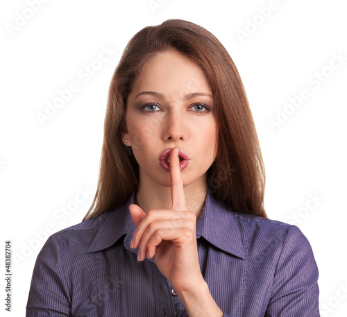 Photo: Beautiful young woman calls for silence Beautiful young woman calls for silence