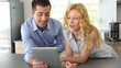Video: Young couple websurfing with tablet in home kitchen Young couple websurfing with tablet in home kitchen