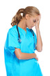 Photo: Doctor holding her head in anguish Doctor holding her head in anguish