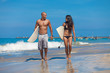 Young couple walking on beach