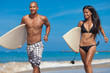 Young couple running on beach