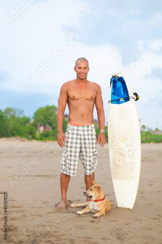 Photo: young man with surfboard young man with surfboard