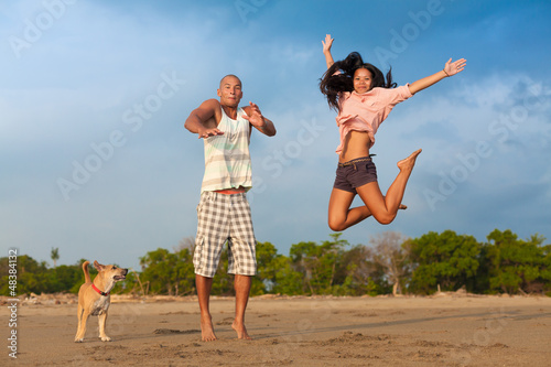 Photo: young couple jumping young couple jumping