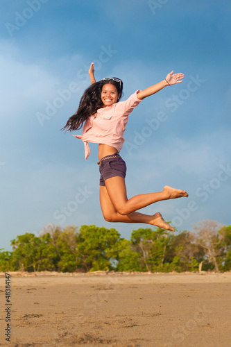 Photo: young woman jumping young woman jumping