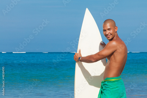 Photo: young man with surfboard young man with surfboard