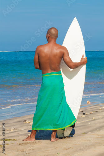 Photo: young man with surfboard young man with surfboard
