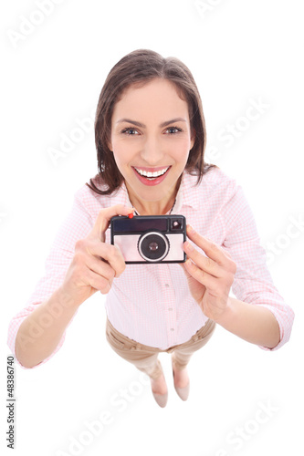 Photo: Woman using vintage camera Woman using vintage camera