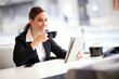 Businesswoman on a coffee break, using tablet computer