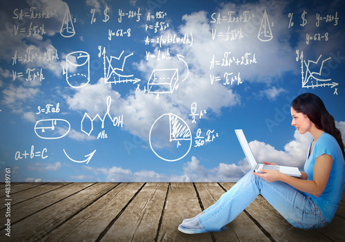 Photo: Young woman with laptop computer. Young woman with laptop computer.
