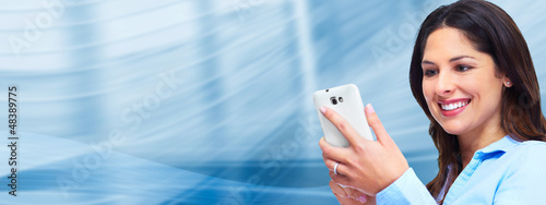 Photo: Business woman with a smartphone. Business woman with a smartphone.