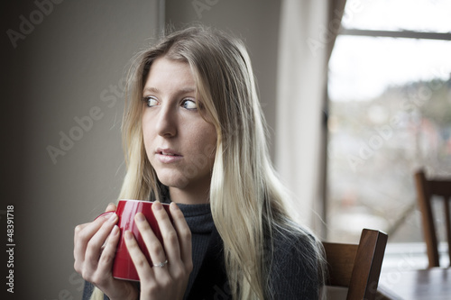 Photo: Young Woman Drinking Coffee Young Woman Drinking Coffee