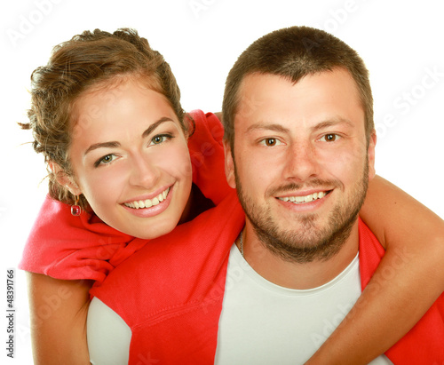 Photo: Young man and woman together over white background Young man and woman together over white background