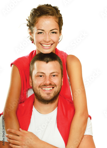 Photo: Young man and woman together over white background Young man and woman together over white background