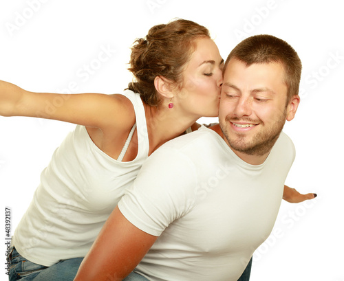Photo: Young man and woman together over white background Young man and woman together over white background