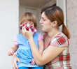  woman wipes snivels  daughter