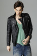 Handsome young man in a t-shirt, jeans and a leather jacket