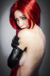 beautiful woman in sexy evening dress against dark background